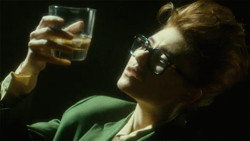 Woman Wearing Glasses Holding Water GIF