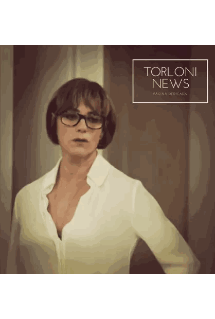 Woman Wearing Glasses in Front of Torloni News Sign