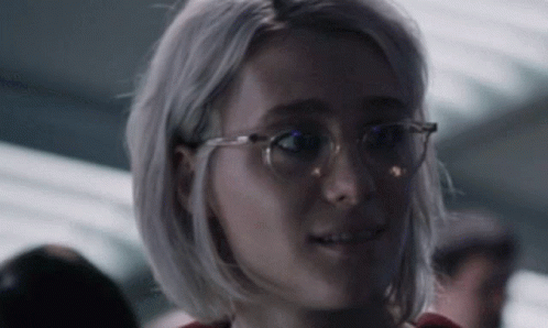 Woman Wearing Glasses Looking At Camera GIF