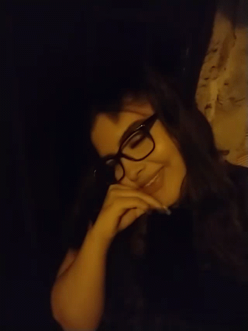Woman Wearing Glasses Lying Down Smiling