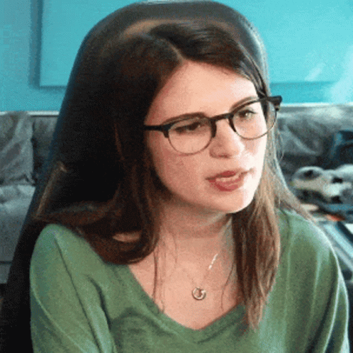 Woman Wearing Glasses Sitting with Mouth Open
