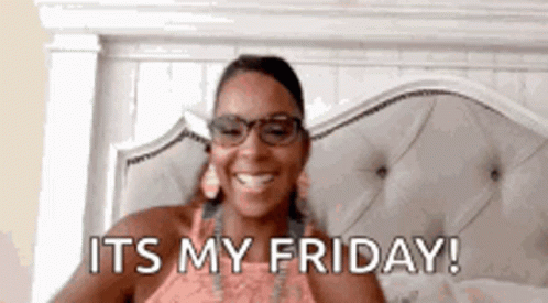Woman Wearing Glasses Smiling In Bed GIF
