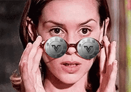 Woman Wearing Glasses with V Coin