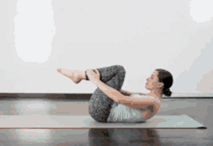 Woman Wearing Gray Doing Pilates Crunches Exercise GIF