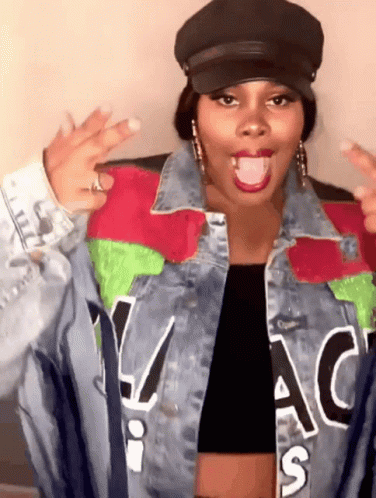 Woman Wearing Hat And Denim Jacket GIF