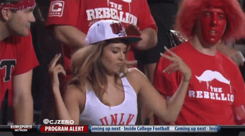 Woman Wearing Hat Saying The Rebellion Dancing in Crowd