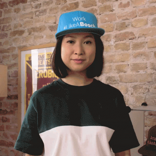 Woman Wearing Hat Saying Work #Likeabosch GIF