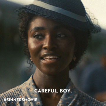Woman Wearing Hat with Careful Boy