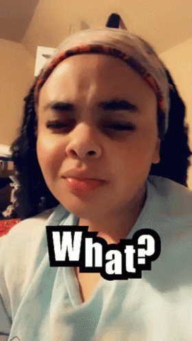 Woman Wearing Headband and Blue Shirt Saying What