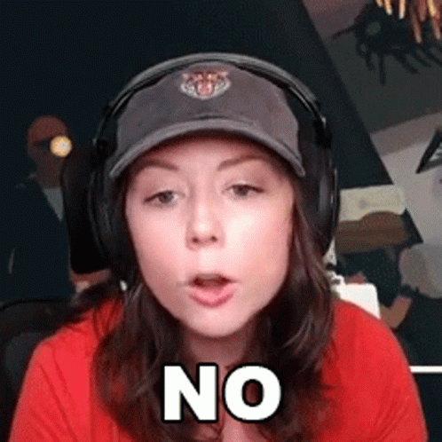 Woman Wearing Headphones And Baseball Cap Making No Sign GIF
