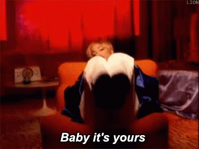 Woman Wearing Headphones and Beanie Says Going Forward