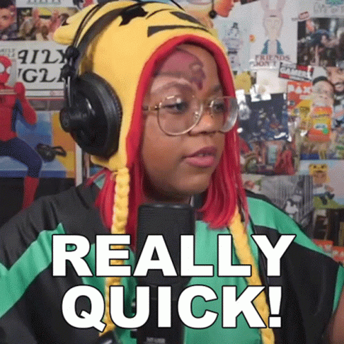 Woman Wearing Headphones and Hat Says Really Quick