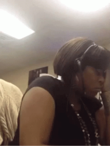 Woman Wearing Headphones And Necklace GIF