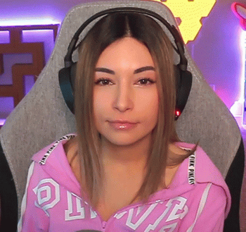 Woman Wearing Headphones and Pink Hoodie