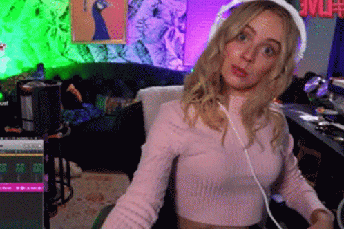 Woman Wearing Headphones And Pink Sweater GIF