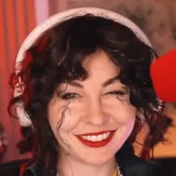 Woman Wearing Headphones and Red Lipstick