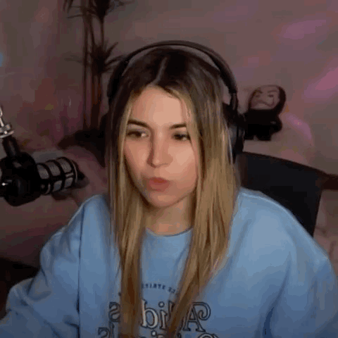 Woman Wearing Headphones at Microphone