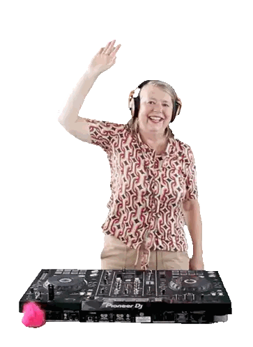 Woman Wearing Headphones Behind DJ Mixer