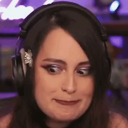 Woman Wearing Headphones Making Face