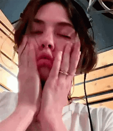 Woman Wearing Headphones Making Face GIF