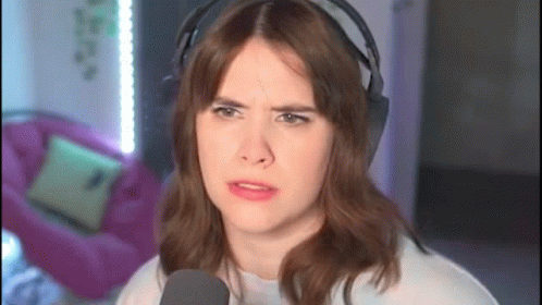 Woman Wearing Headphones Making Funny Face