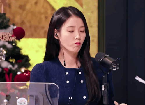 Woman Wearing Headphones Making Funny Face
