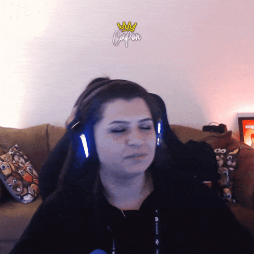 Woman Wearing Headphones Saying Capon