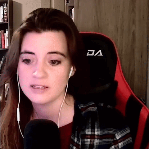 Woman Wearing Headphones Sitting In Red And Black Chair GIF