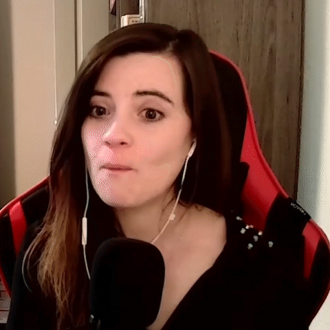 Woman Wearing Headphones Sitting In Red Chair GIF