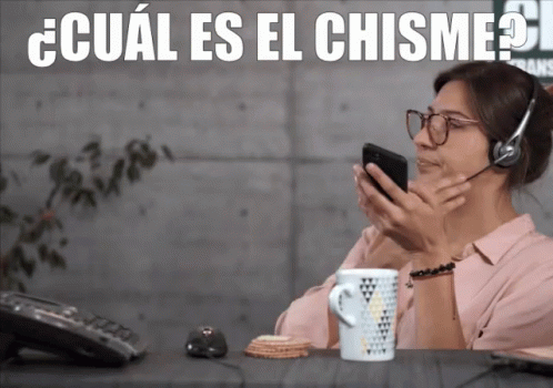 Woman Wearing Headset Looking at Phone Cual Es El Chisme