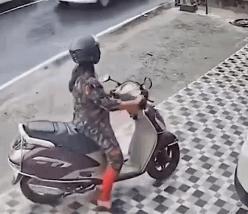 Woman Wearing Helmet Riding Scooter