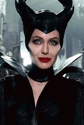 Woman Wearing Horned Black Hat and Red Lips