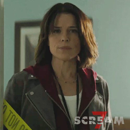 Woman Wearing Leather Jacket and Scream Lanyard