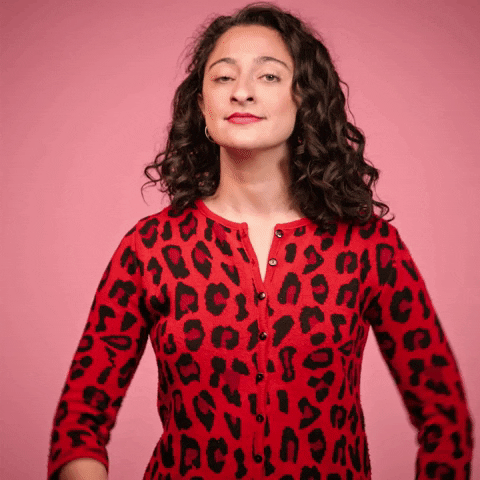 Woman Wearing Leopard Top Bow Hand Sign GIF