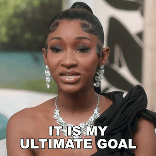 Woman Wearing Necklace and Earrings Says It Is My Ultimate Goal