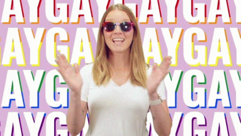Woman Wearing Sunglasses in Front of Ayga Background