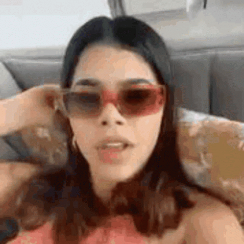 Woman Wearing Sunglasses Making Funny Face