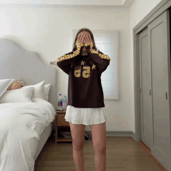Woman Wearing Sweater with 22