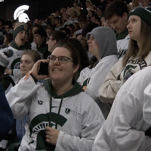 Woman Wearing The Lodge of Michigan Sweatshirt
