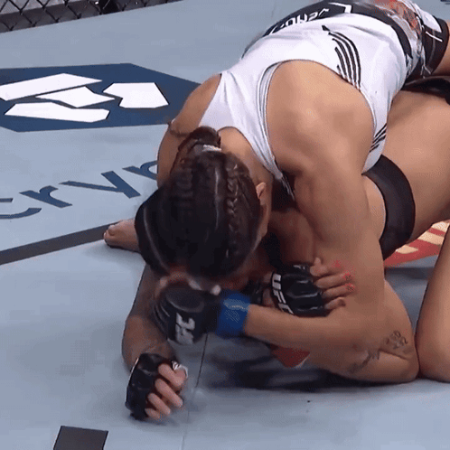 Woman Wearing UFC Glove Holding Arm