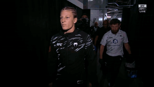 Woman Wearing UFC Jacket Walking