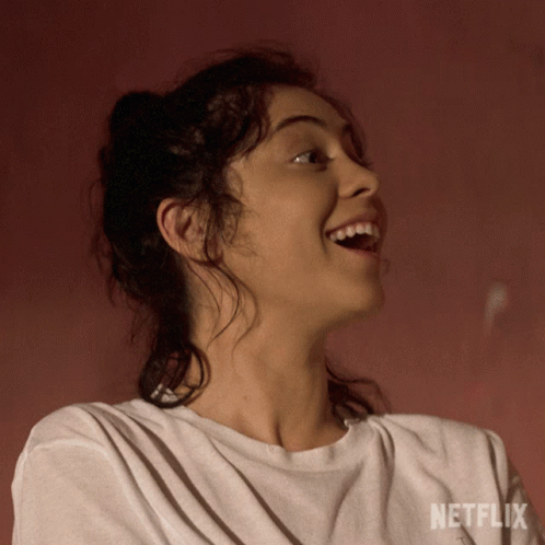 Woman Wearing White Shirt With Word Netflix