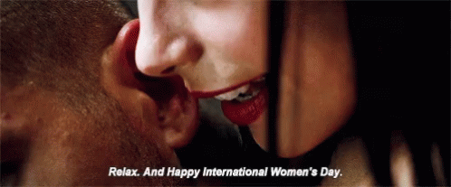 Woman Whispering Relax And Happy International Women's Day In Man's Ear GIF