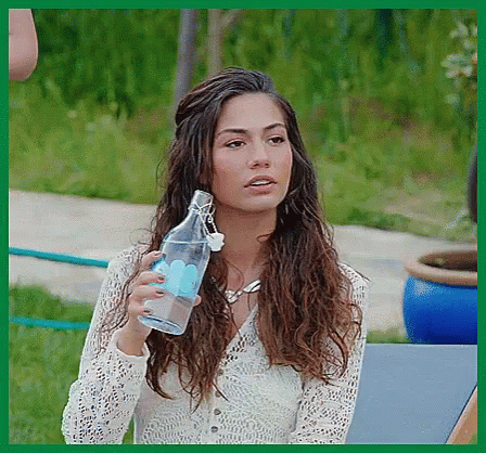 Woman White Lace Top Holding Clear Water Bottle GIF