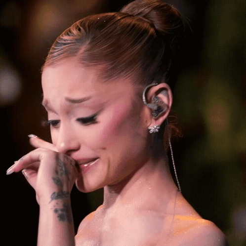 Woman Wiping Face With Wrist Tattoo GIF