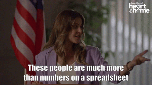 Woman With American Flag Saying People Are More Than Numbers