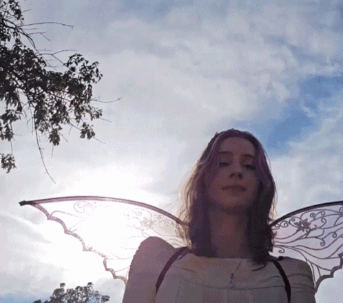 Woman With Angel Wings By Tree GIF