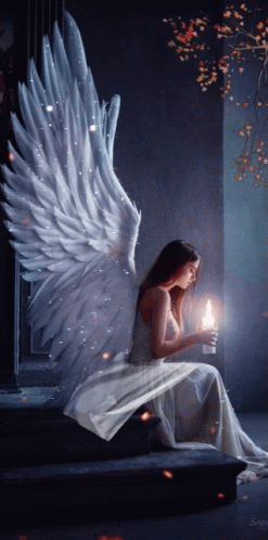 Woman With Angel Wings Holding Candle