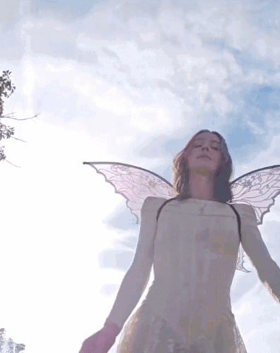 Woman With Angel Wings In White Dress Blue Sky GIF