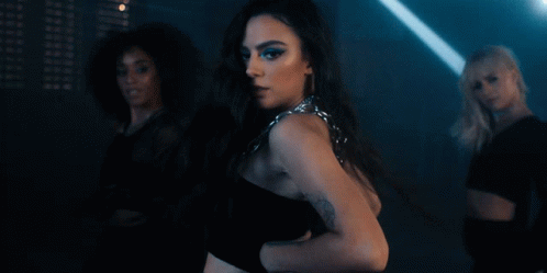 Woman With Arm Tattoo Dancing With Two Women